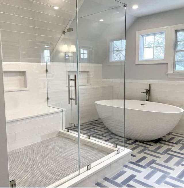 luxury bathroom remodeled and renovated in minneapolis minnesota with white bathtub and white tile