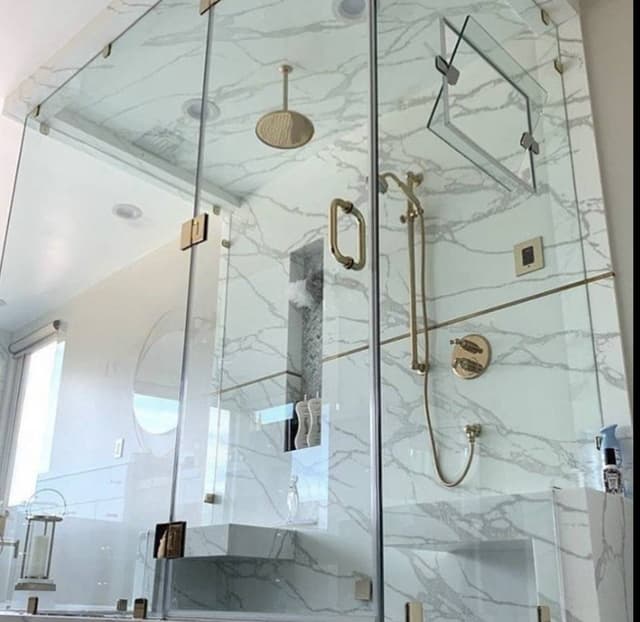 glass enclosed shower with overhead showerhead remodeled in minneapolis minnesota 