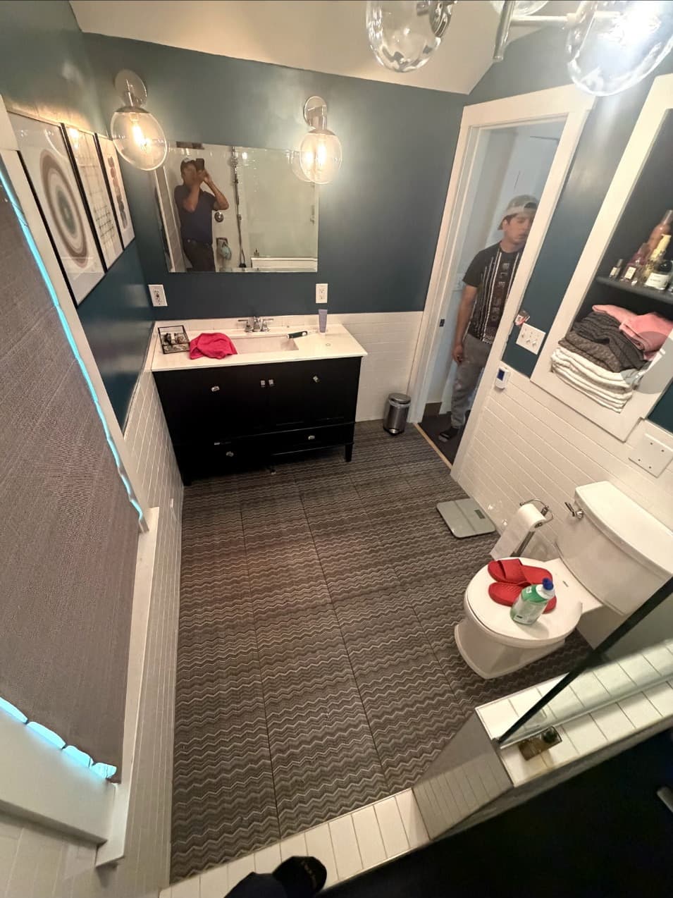 Bathroom with dark vanity, white walls and patterned tile floor remodeled in Minneapolis, MN