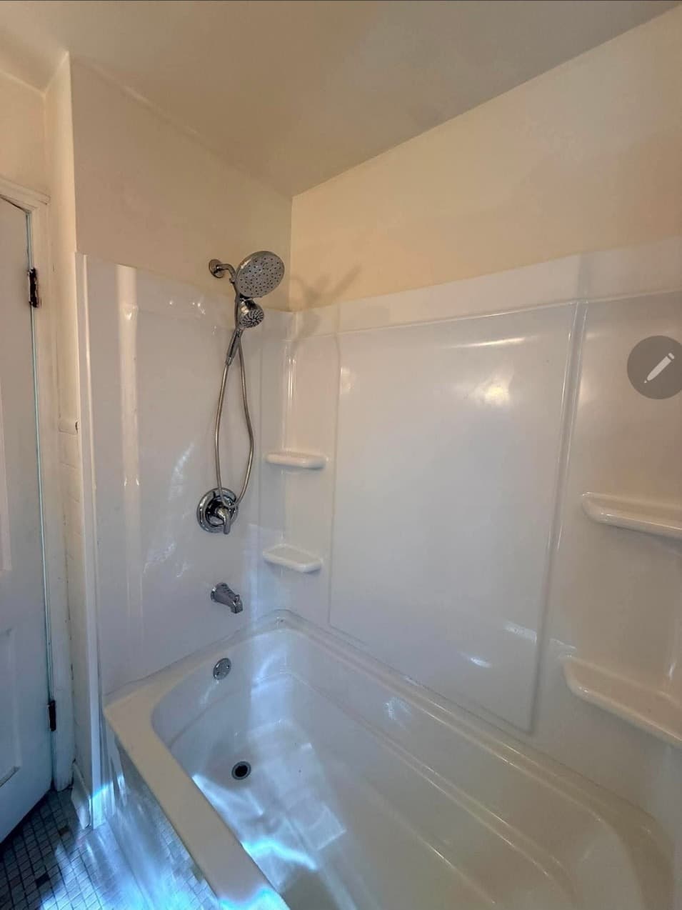 New white acrylic tub surround with a window, ready for caulking, by Midwest Bath & Shower